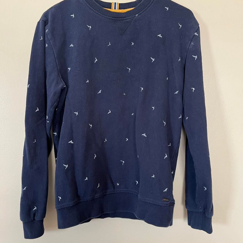 Navy Denim & Flower by Ricky Singh navy crewneck sweatshirt with white seagulls